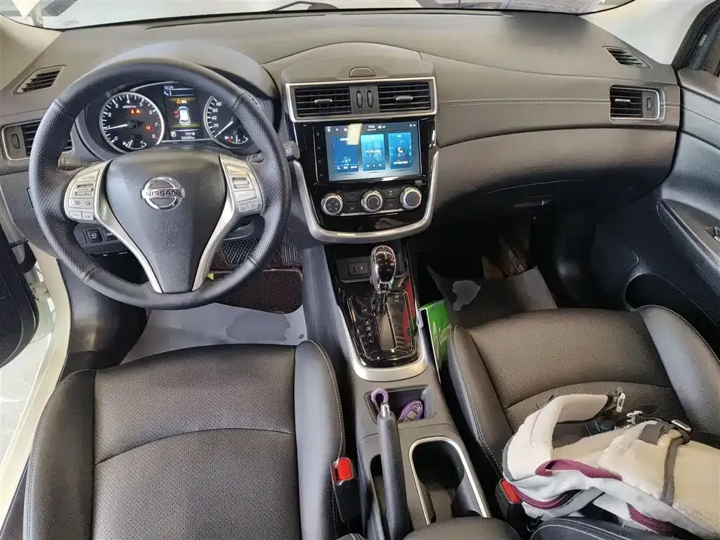 Nissan Tiida — фото 10