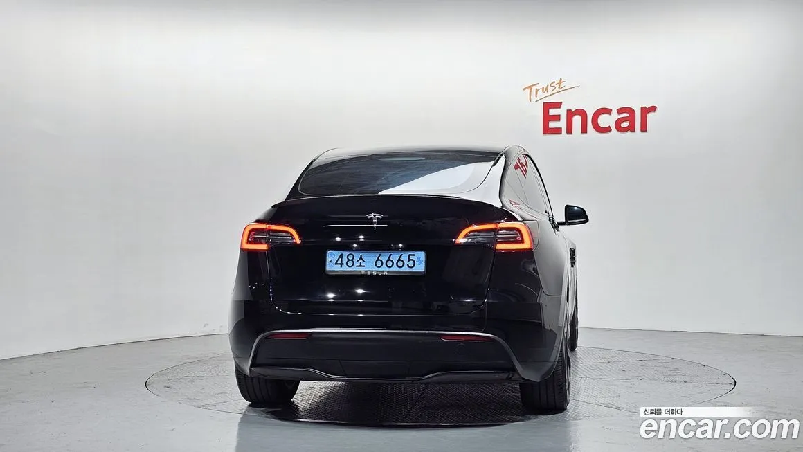 Tesla Model Y — фото 10