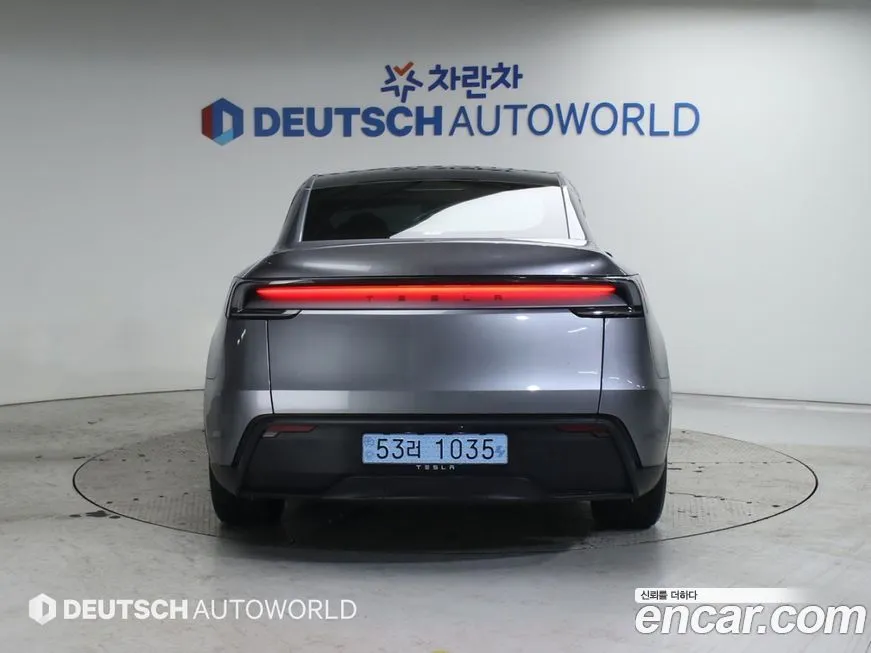 Tesla Model Y — фото 10