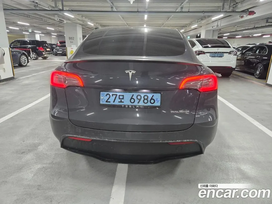 Tesla Model Y — фото 10