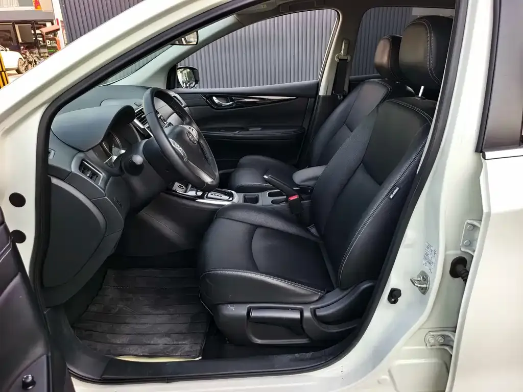 Nissan Tiida — фото 10